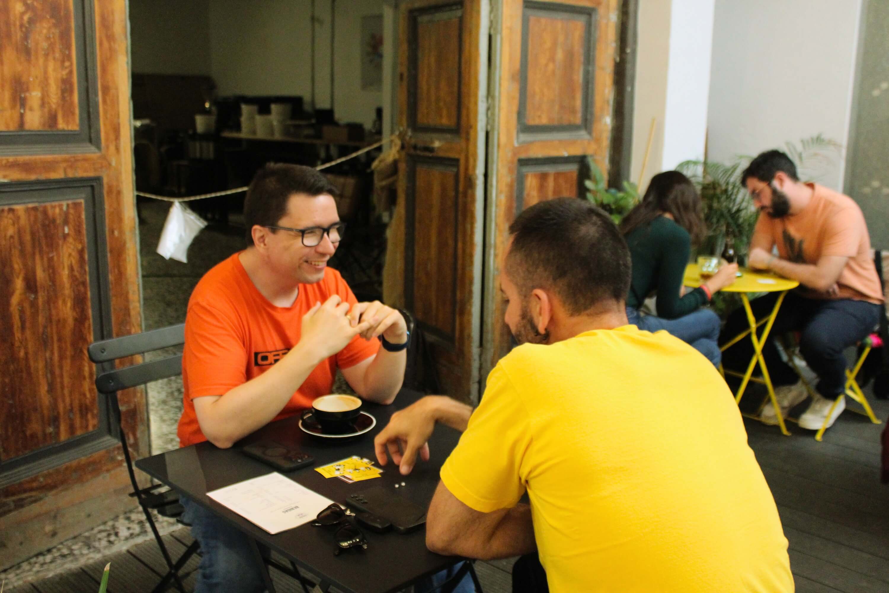 Friends laughing together at an Introverts Social Club event